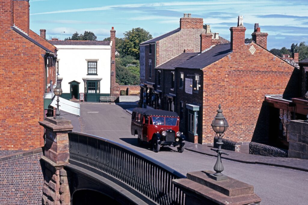 An old-fashioned street and car on a bridge at the Black Country Living Museum in the UK