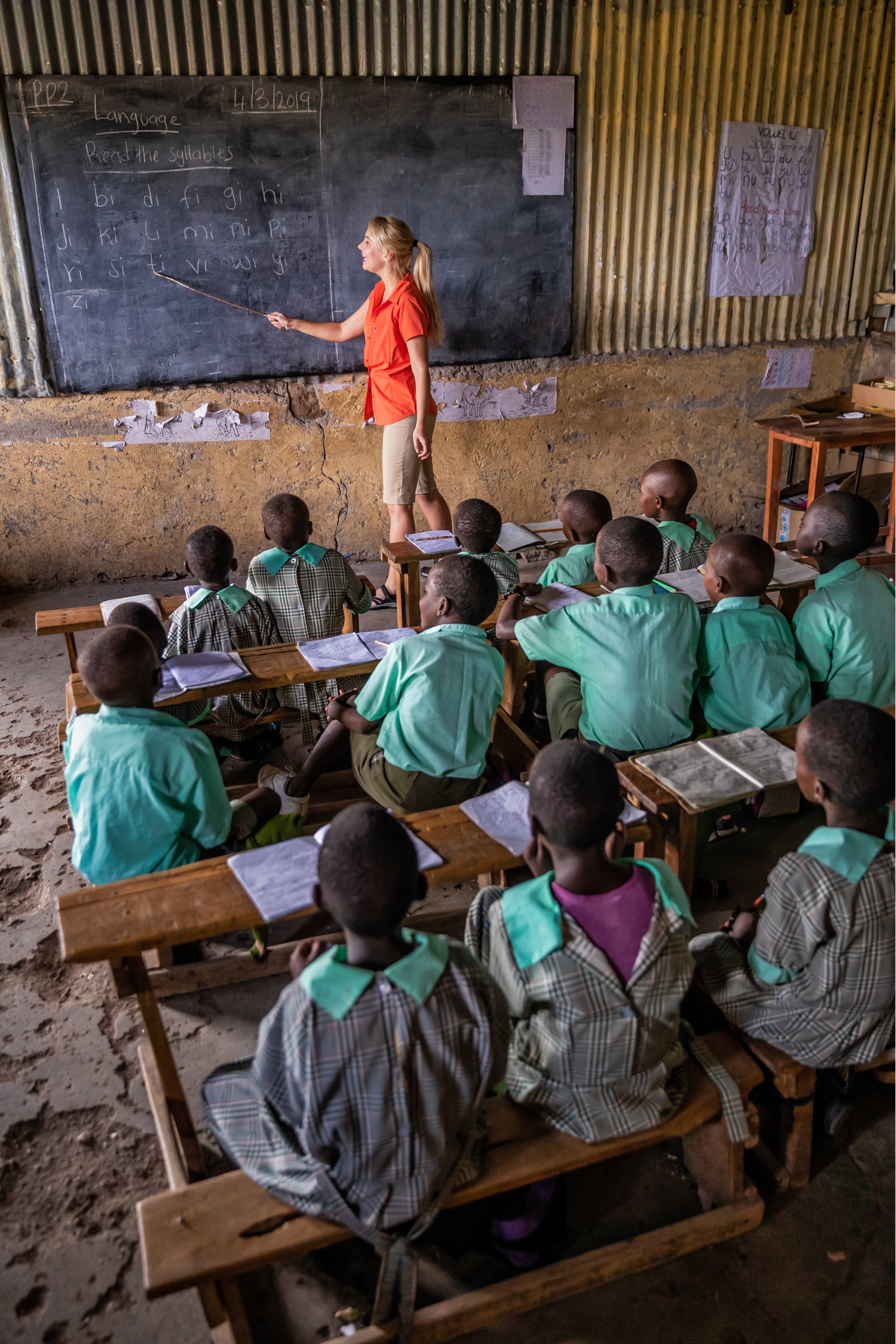 Volunteer teaching children at a school in Kenya