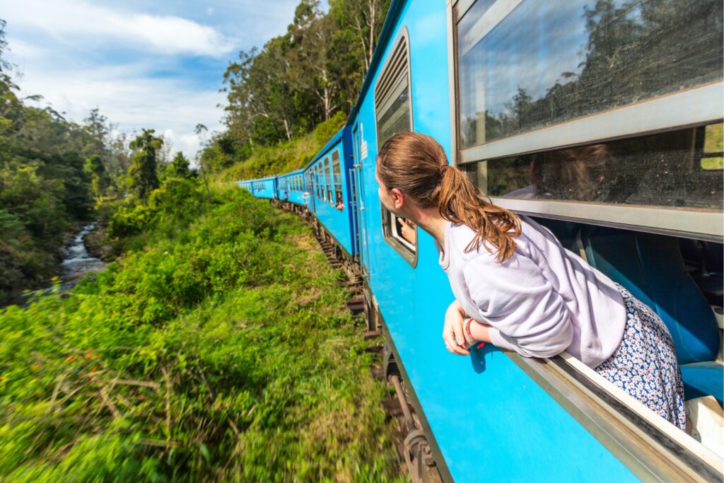 Girl on train looking out window