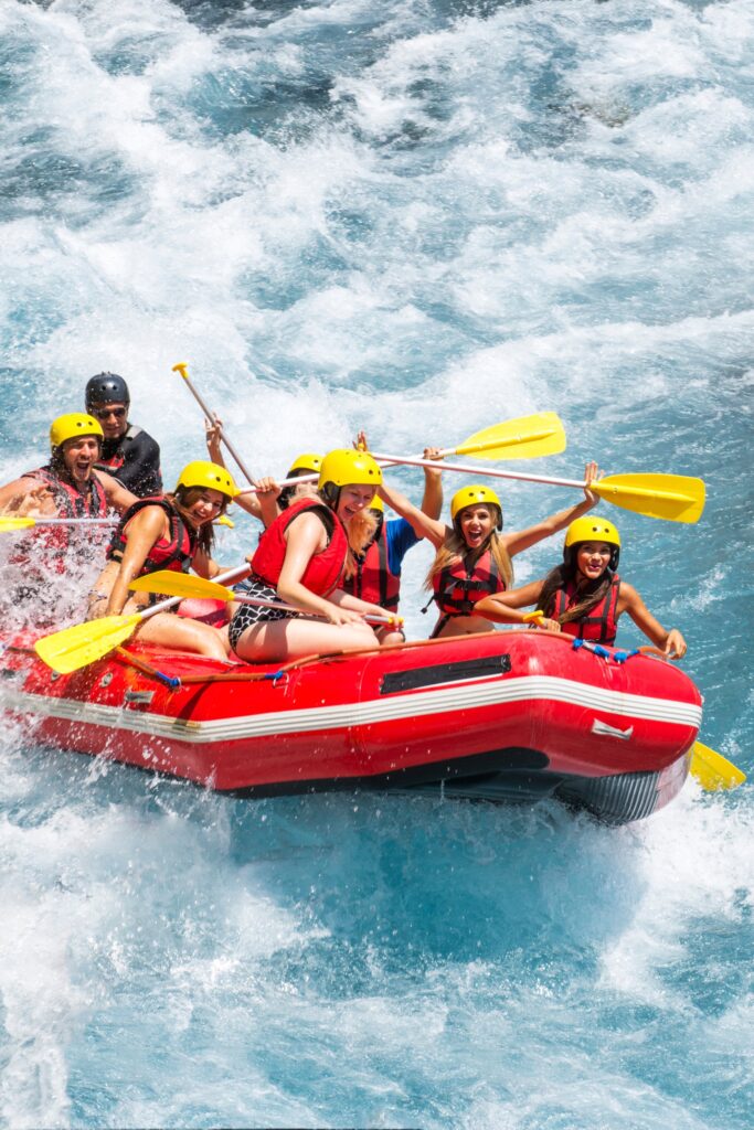Group of people white water rafting