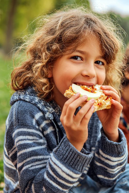 Child eating outdoors
