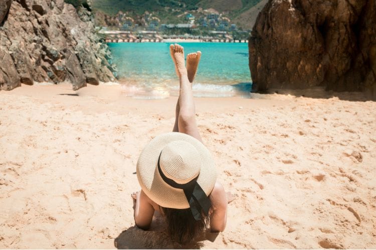 Tourist relaxing on beach